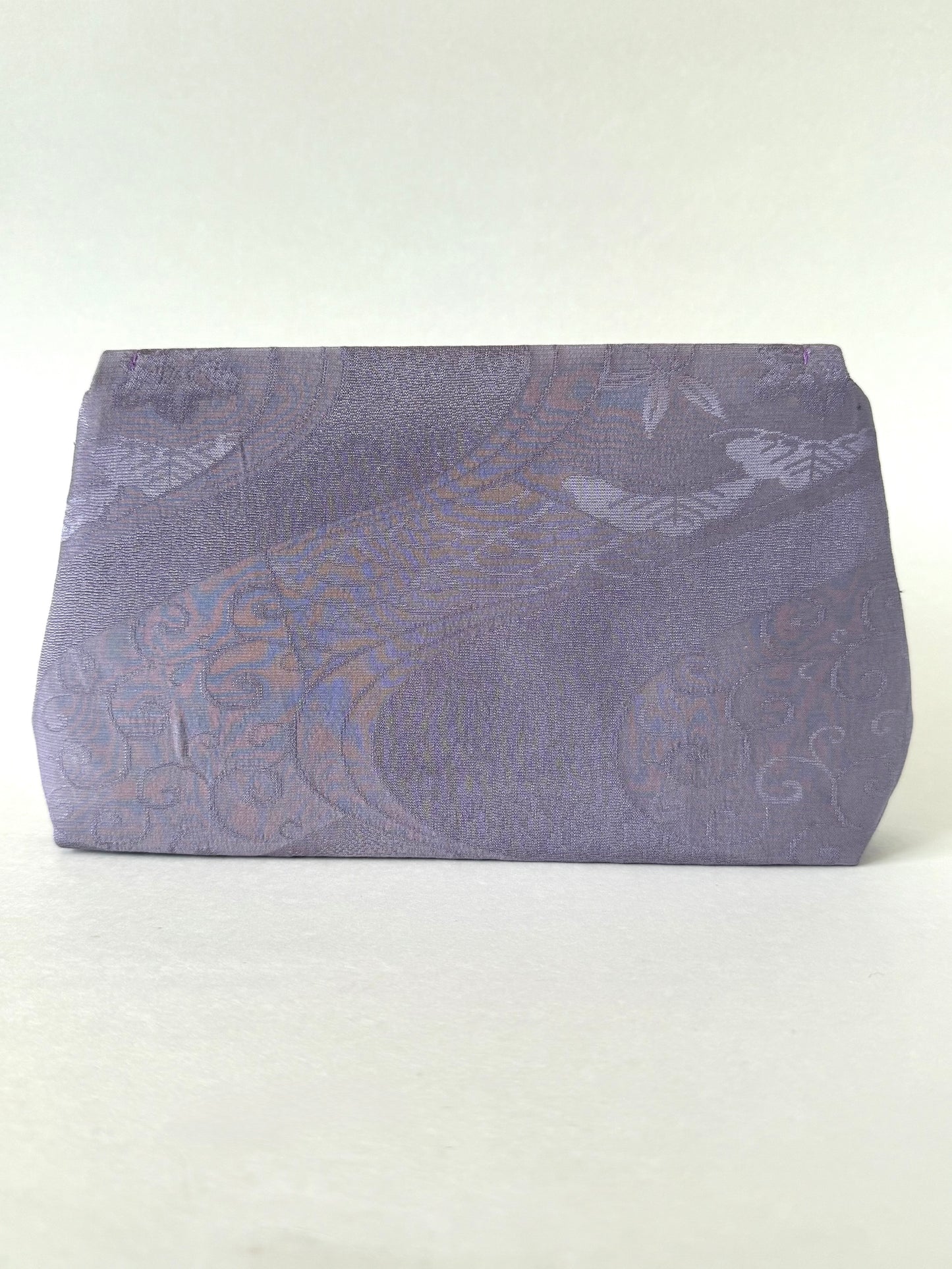 Back view of purple kimono chirimen silk clutch with floral and wagara patterns