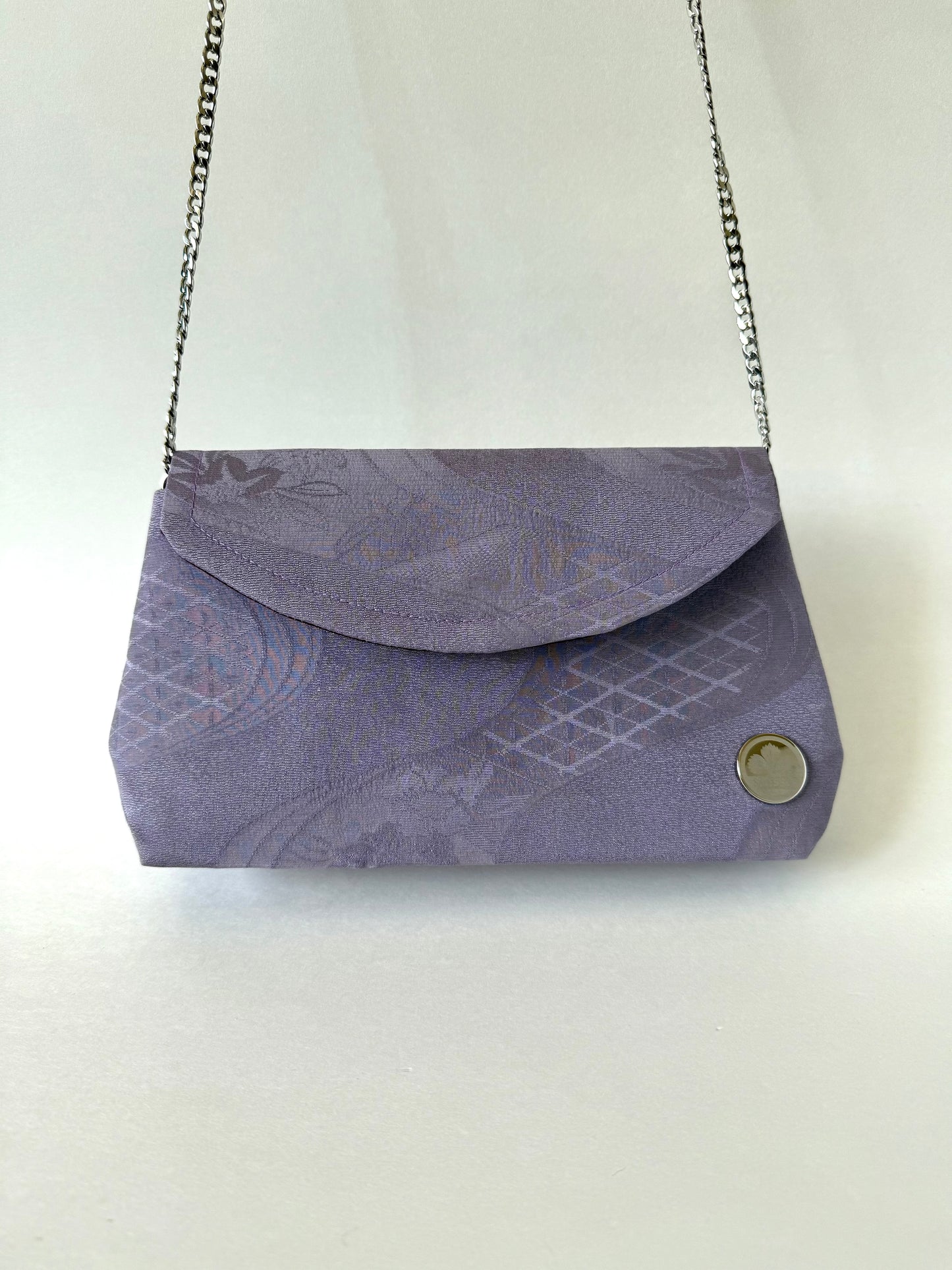 Purple kimono clutch with detachable 48-inch metal chain strap discreetly connected inside