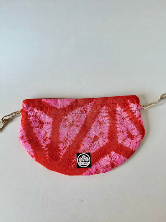 Front view of Upcycled red and pink kimono silk drawstring pouch with hemp drawstrings