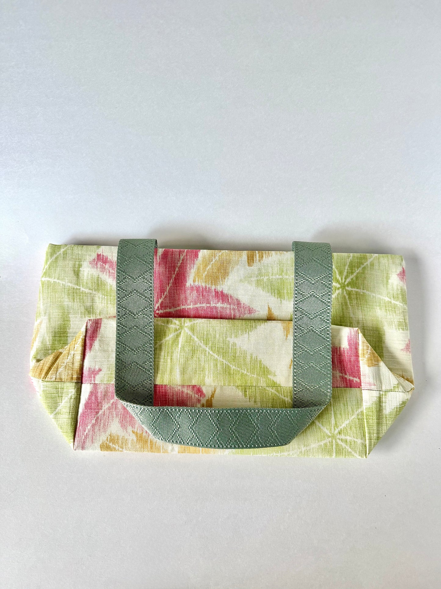 Back view of textured kimono silk tote bag laying flat