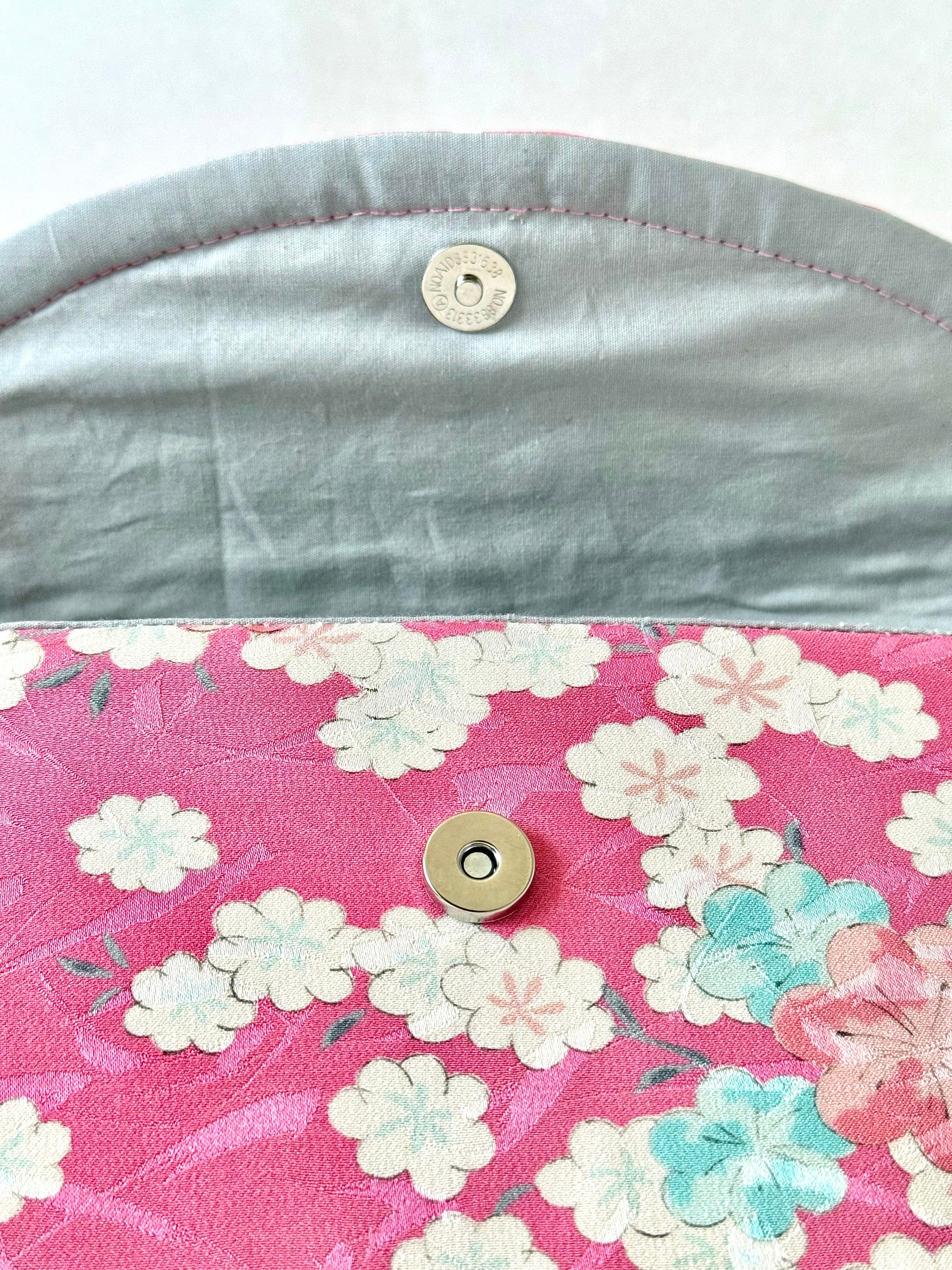 Close up of magnetic closure and pink kimono silk