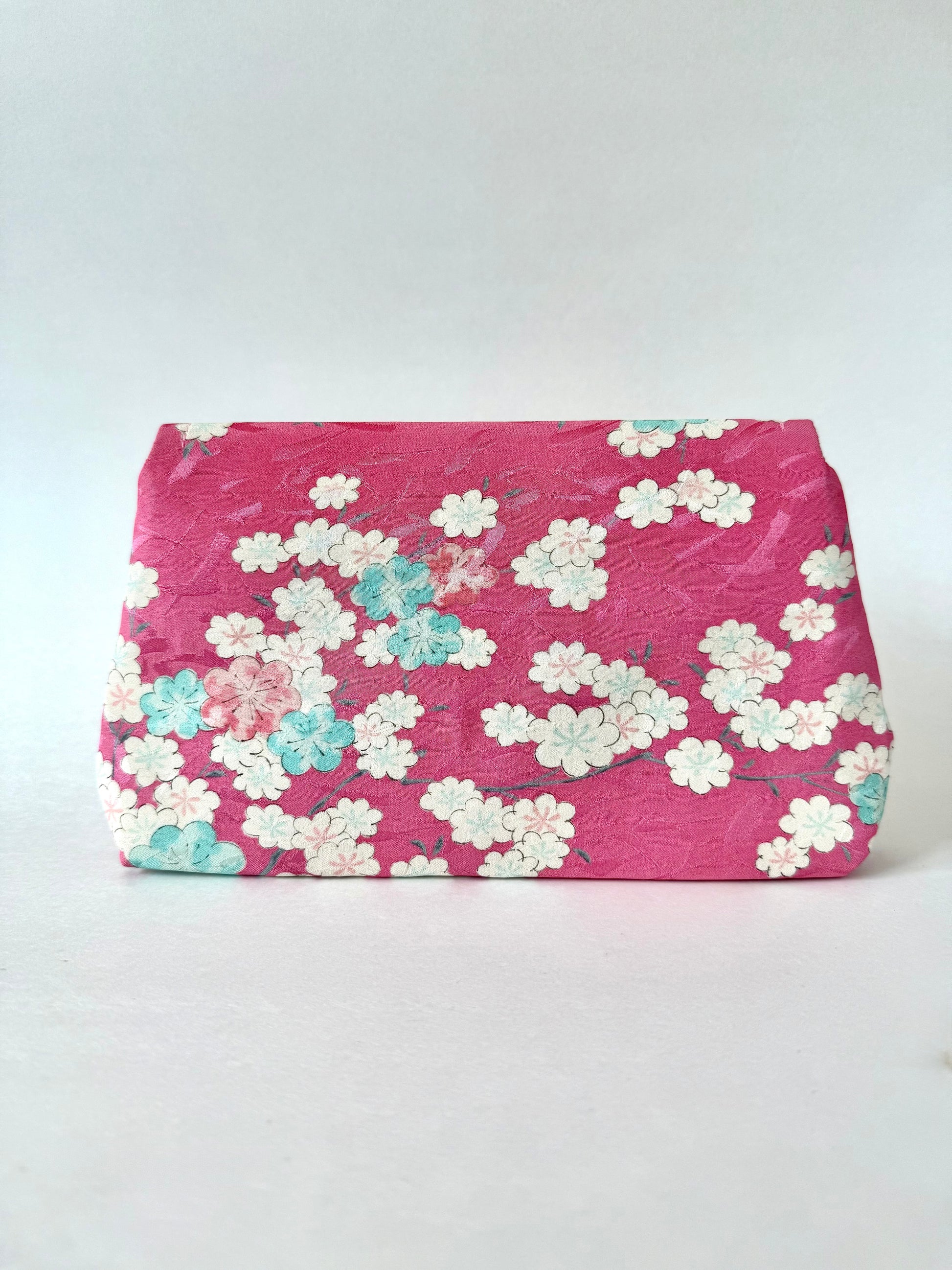 Backside view of clutch bag made from pink kimono silk
