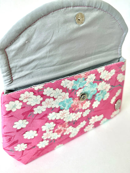 Close up of hand stitched seam on silk cherry blossom clutch bag
