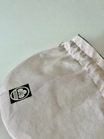 Close up of light blush pink kimono silk with slightly darker pink top stitching