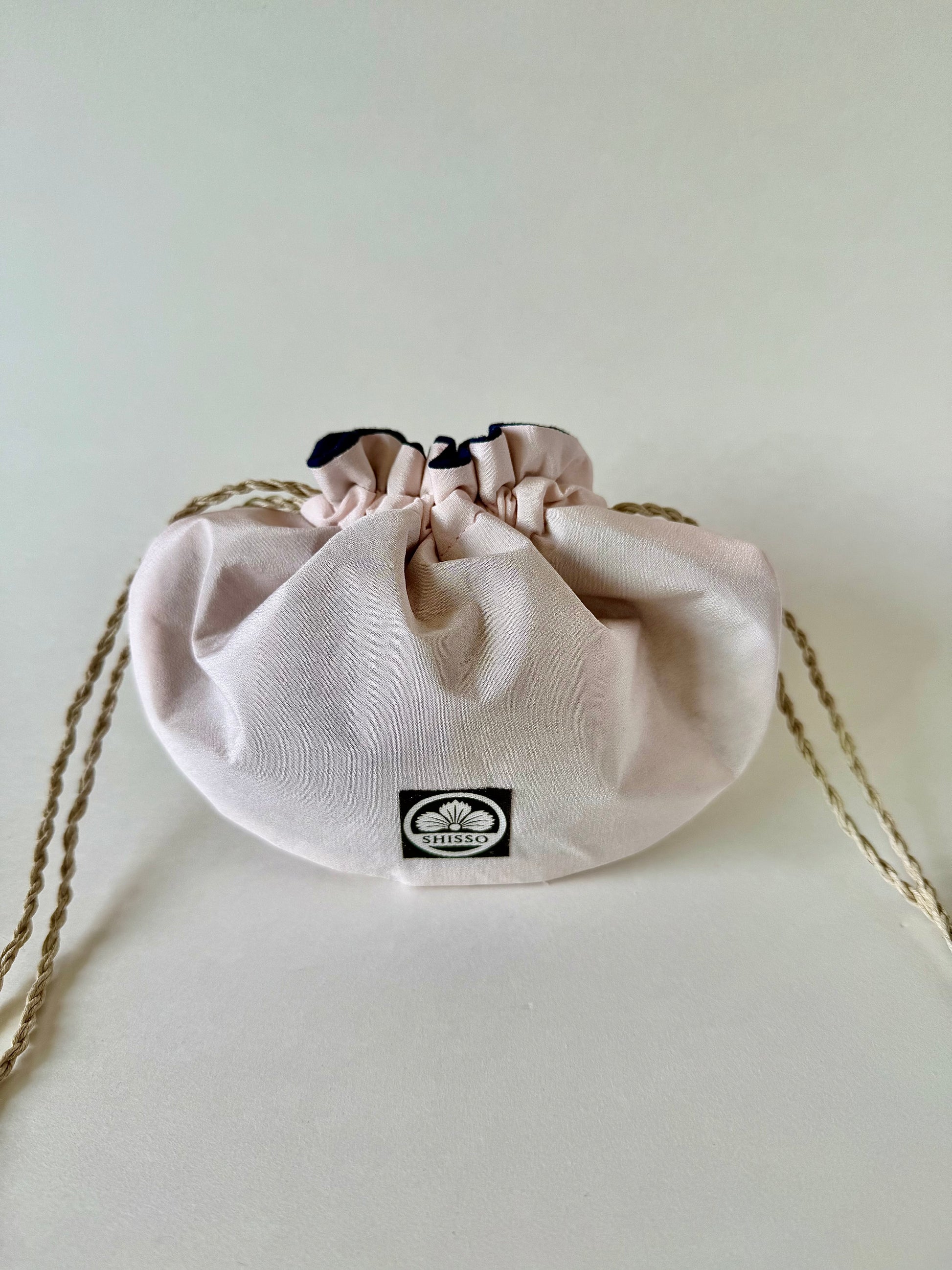 Light pink kimono silk drawstring pouch with hemp cord drawstrings cinched