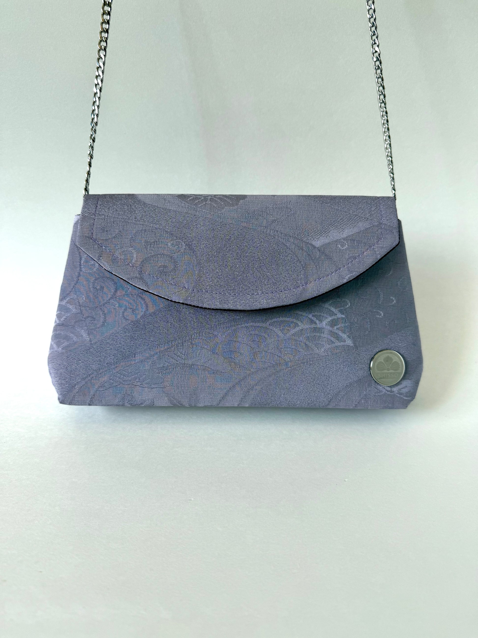 Purple chirimen silk clutch bag hanging from 48 inch metal chain link strap