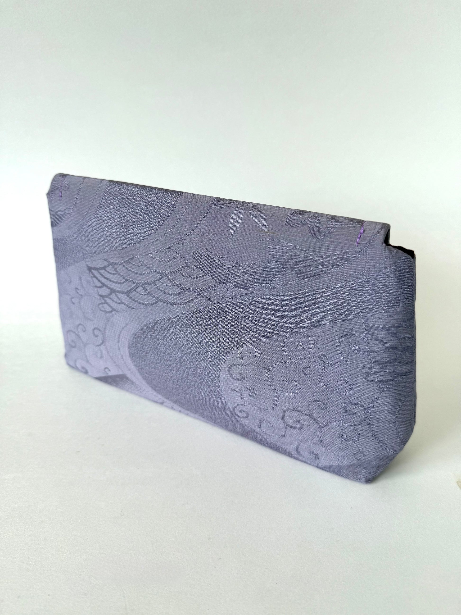 Backside of purple chirimen silk with seigaiha, wagara, and river motifs