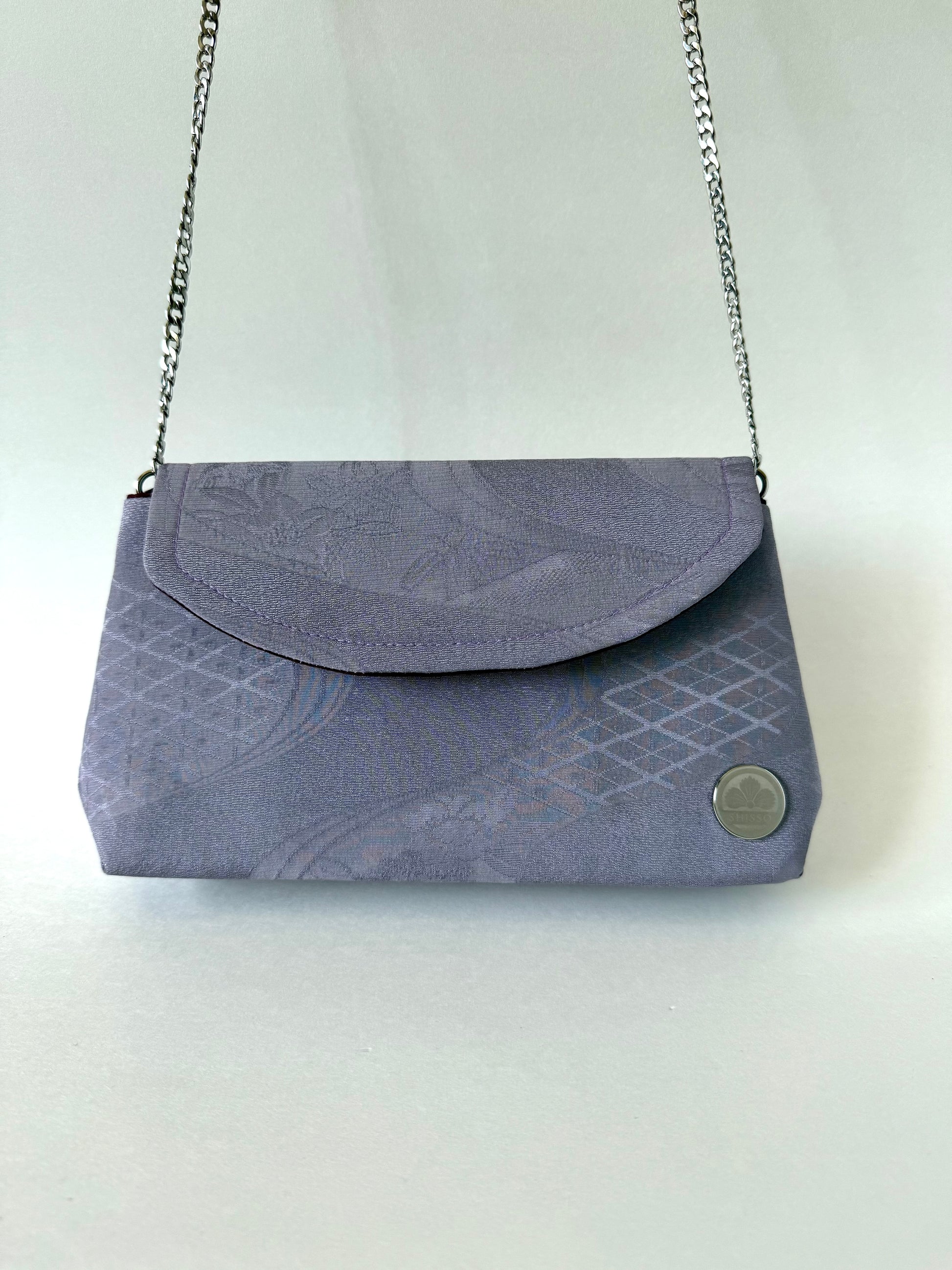 Purple chirimen silk clutch hanging from detachable metal chain strap