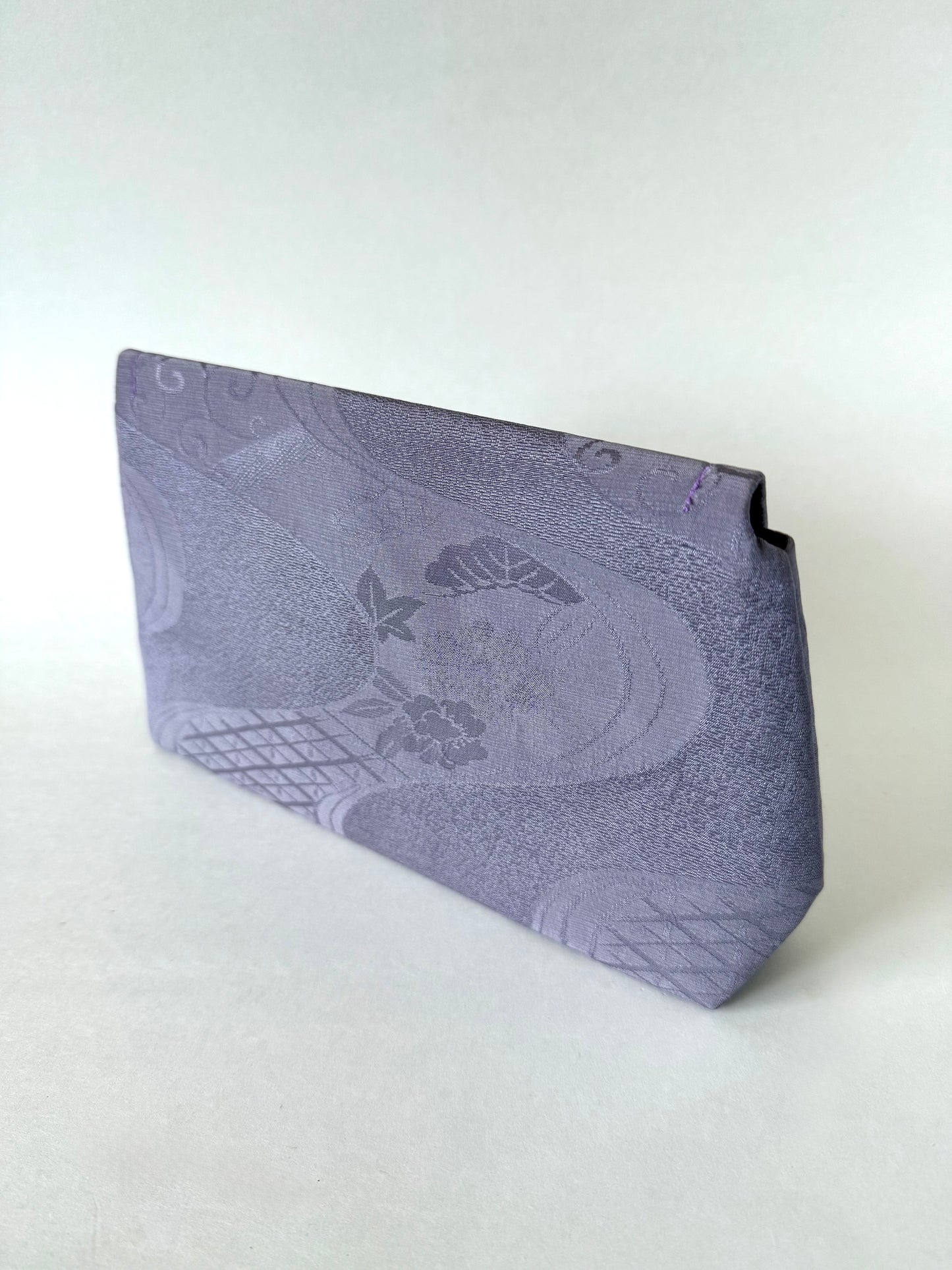 Back view of purple kimono chirimen silk clutch bag with sheer floral and river motifs