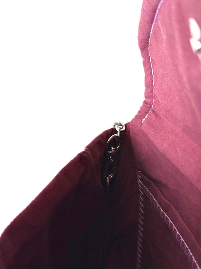 48 inch silver colored detachable metal chain strap connected to wine colored cotton broad cloth interior