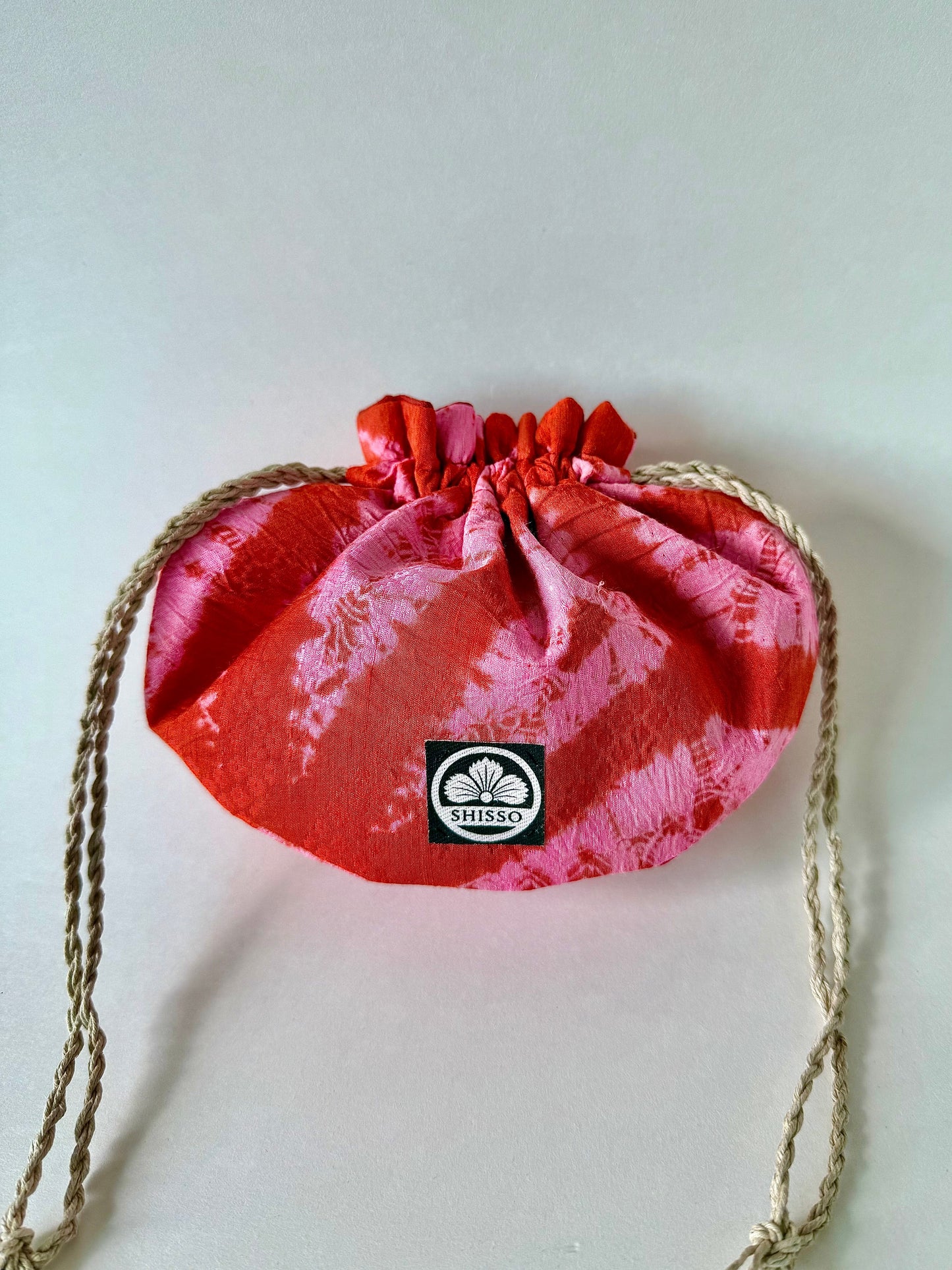 Upcycled red and pink shibori kimono silk drawstring bag with sheen accents and natural hemp drawstrings