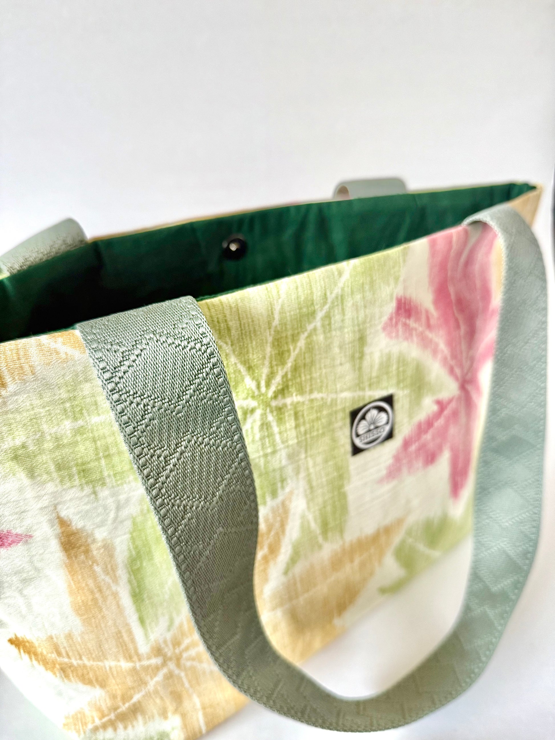 Close up view of diamond pattern on dark olive green webbing straps
