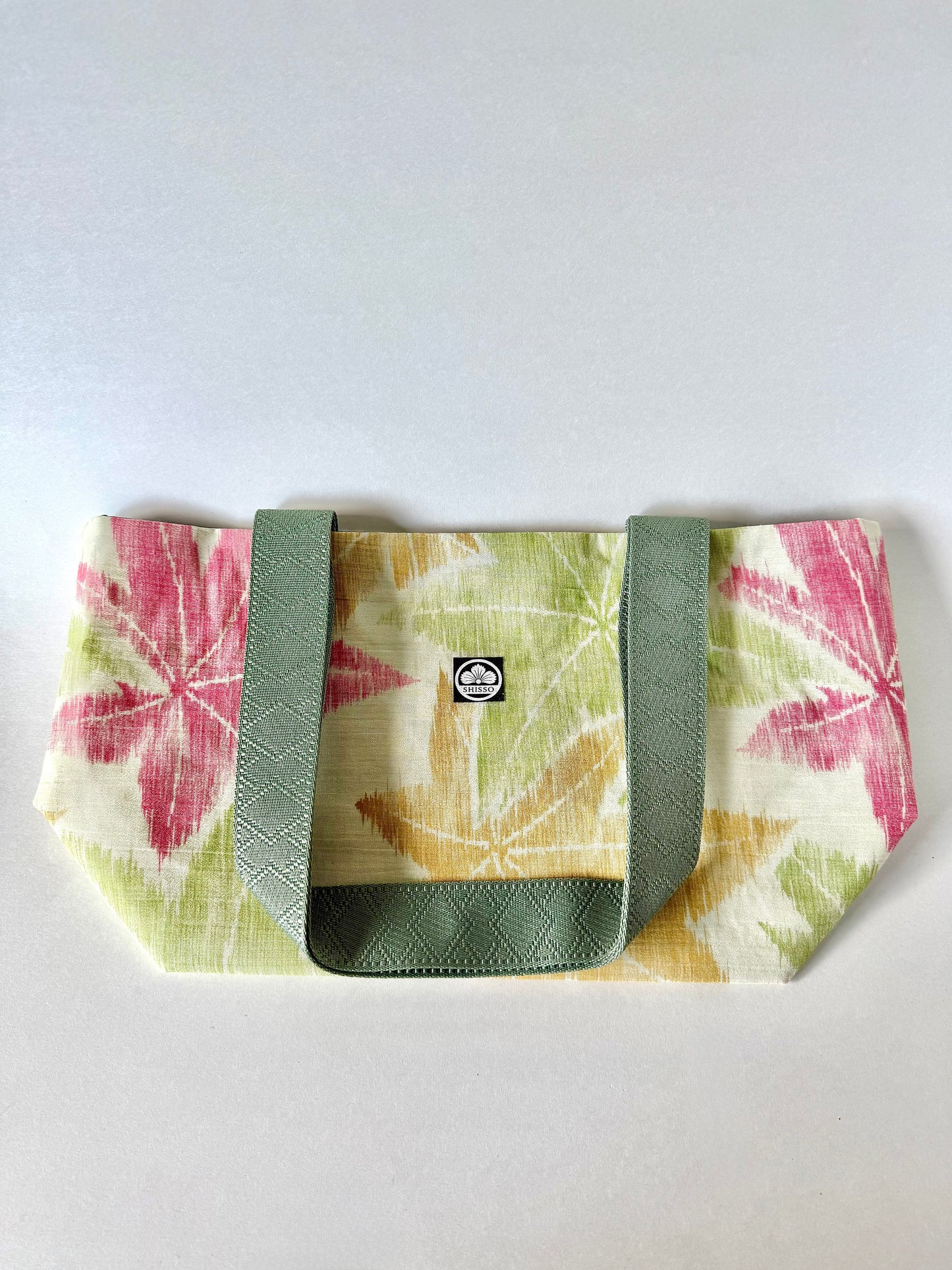 Front view of textured kimono silk tote bag laying flat 