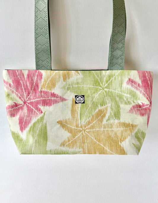 Textured woven kimono silk tote featuring Japanese maple leaf motifs in green, red, and yellow