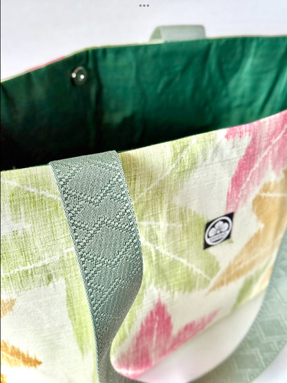close up detail of woven kimono silk texture hand diamond pattern deep sage green handles